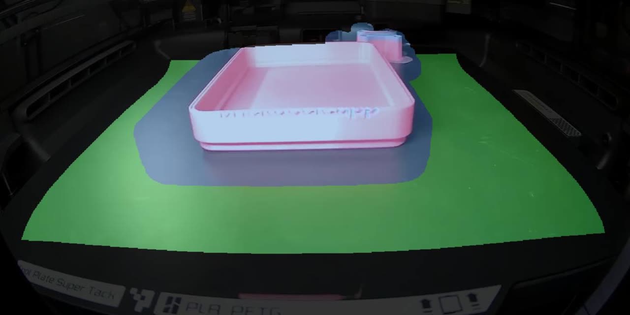 The monitoring view: the plate picked out in green, the part and the area that changed in blue